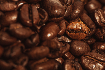 Dark many roasted coffee beans texture backgroundの写真素材
