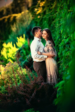 Beautiful young couple on a nature backgroundの写真素材