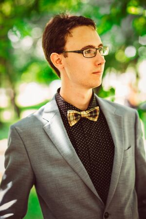 Handsome young guy with a bow tieの写真素材