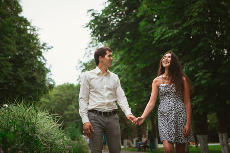 Beautiful young couple on a nature backgroundの写真素材