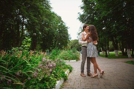 Beautiful young couple on a nature backgroundの写真素材