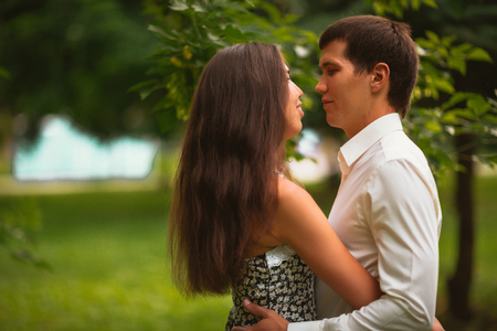 Beautiful young couple in the parkの写真素材