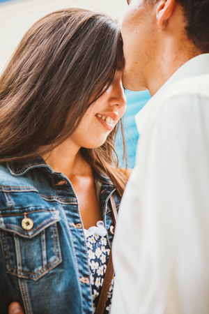 Beautiful young couple on the city backgroundの写真素材
