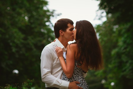 Beautiful young couple on a nature backgroundの写真素材