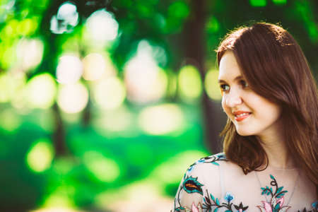 Beautiful young girl on a nature background