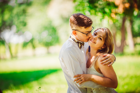 Young beautiful couple on a blurred natural backgroundの写真素材