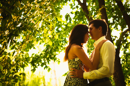 Beautiful young couple in the parkの写真素材