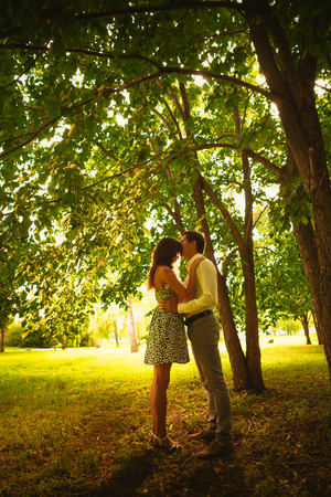 Beautiful young couple in the parkの写真素材