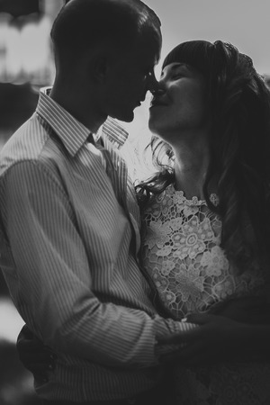 Beautiful young couple on the park backgroundの写真素材