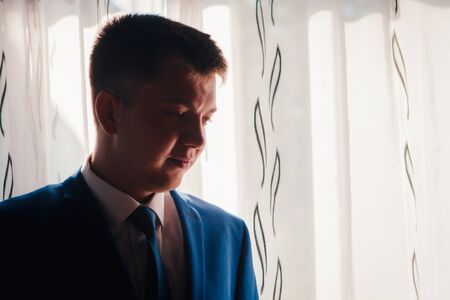 portrait of the groom on a light backgroundの写真素材