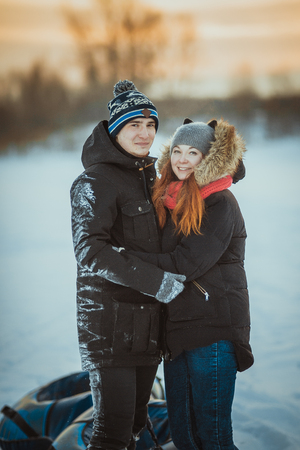 Young couple on winter outdoors portrait.の写真素材