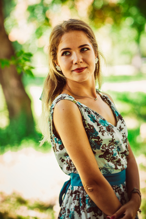 Young beautiful girl in floral dressの写真素材