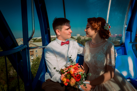 Bride and groom in the Ferris wheelの写真素材