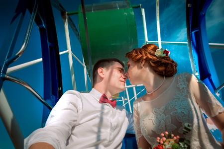 Bride and groom in the Ferris wheelの写真素材