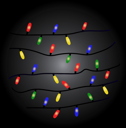 multicolored christmas garland on a dark backgroundの写真素材