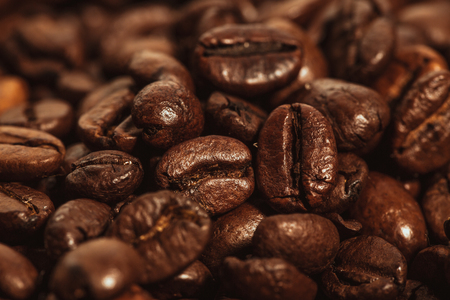 Dark many roasted coffee beans texture background.の写真素材