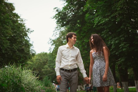 Beautiful young couple on a nature backgroundの写真素材