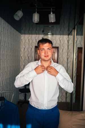 Portrait of the groom on a light backgroundの写真素材
