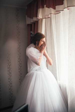 Portrait of a young bride on a light backgroundの写真素材