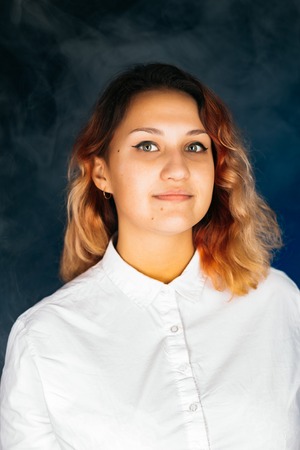 emotional young girl on a dark background
