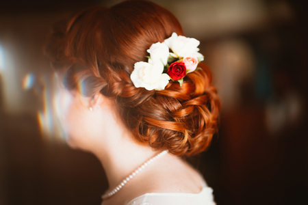 Portrait of a beautiful young bride near the windowの写真素材