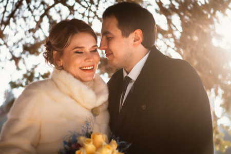 Lovers bride and groom on their winter weddingの写真素材