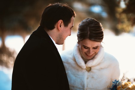 Lovers bride and groom on their winter weddingの写真素材