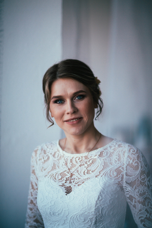 portrait of a bride near a window studio.の写真素材
