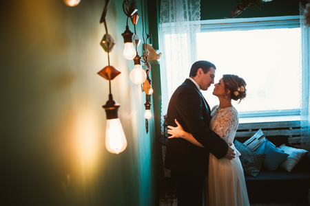 couple groom and bride in light studio.の写真素材