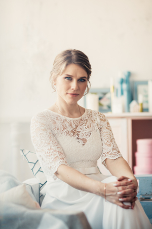 portrait of a bride near a window studio.の写真素材