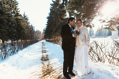 Winter bright wedding bride and groom couple.の写真素材