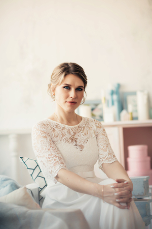 portrait of a bride near a window studio.の写真素材