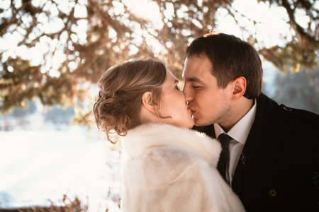 Lovers bride and groom on their winter wedding.の写真素材