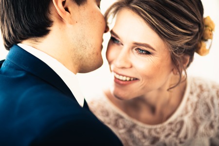 couple groom and bride near the window.の写真素材