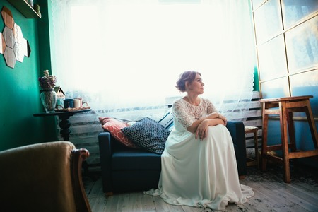 portrait of a bride near a window studio.の写真素材