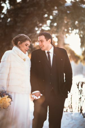 Lovers bride and groom on their winter wedding.の写真素材