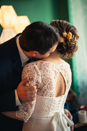 couple groom and bride in light studio.の写真素材