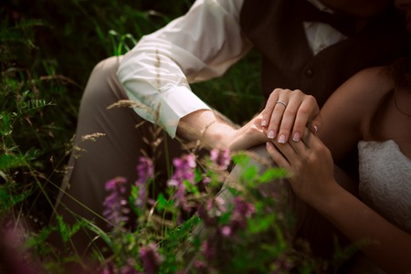 bride and groom portrait on the background of a mountain and grass.の写真素材