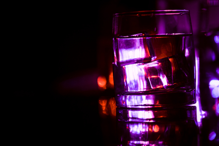 colored lighting of glasses in the night club bar.の写真素材