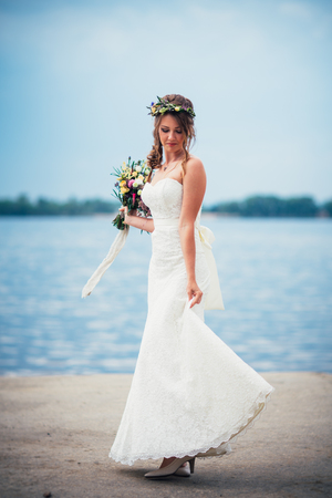 portrait of the bride against the background of the river.の写真素材