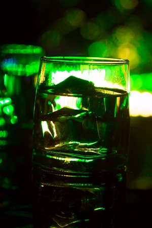 colored lighting of glasses in the night club bar.の写真素材