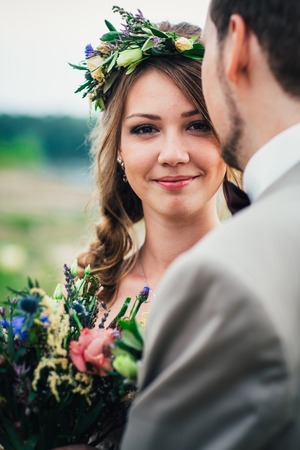 young couple in the style of provence on background of river.の写真素材