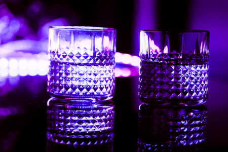bar colored lights with glasses of alcohol.
