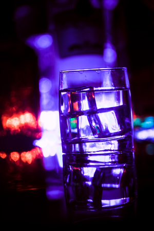colored lighting of glasses in the night club bar.の写真素材