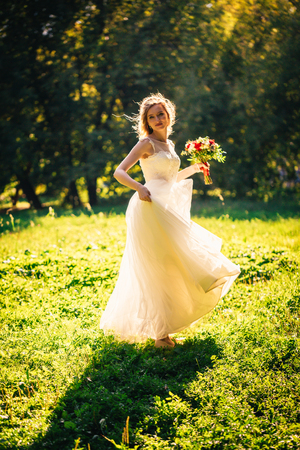beautiful young bride in the garden background.の写真素材