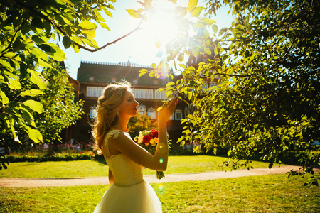 beautiful young bride in the garden background.の写真素材