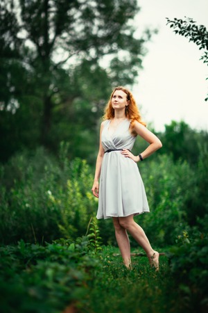 portrait of a girl against a nature background.の写真素材