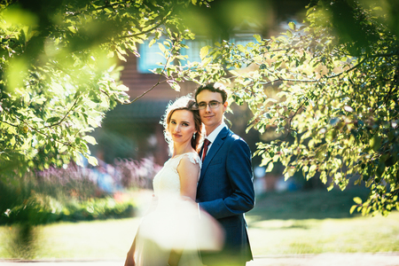 bride and groom on background summer forest.の写真素材