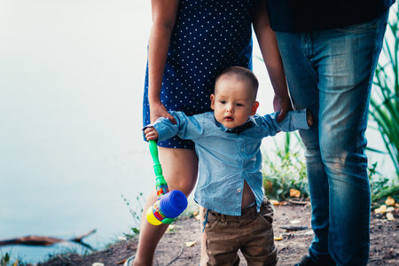 happy family with son on background forestの写真素材