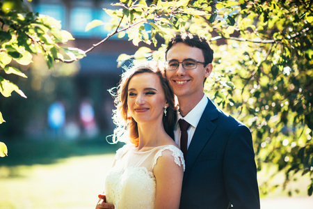 bride and groom on background summer forest.の写真素材
